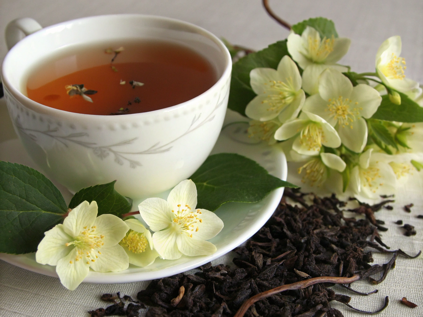 Steaming cup of Earl Grey tea with fresh bergamot zest